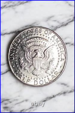 1990-D Kennedy Half Dollar About Uncirculated